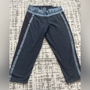 Navy Lululemon cropped leggings with logo on the waist band